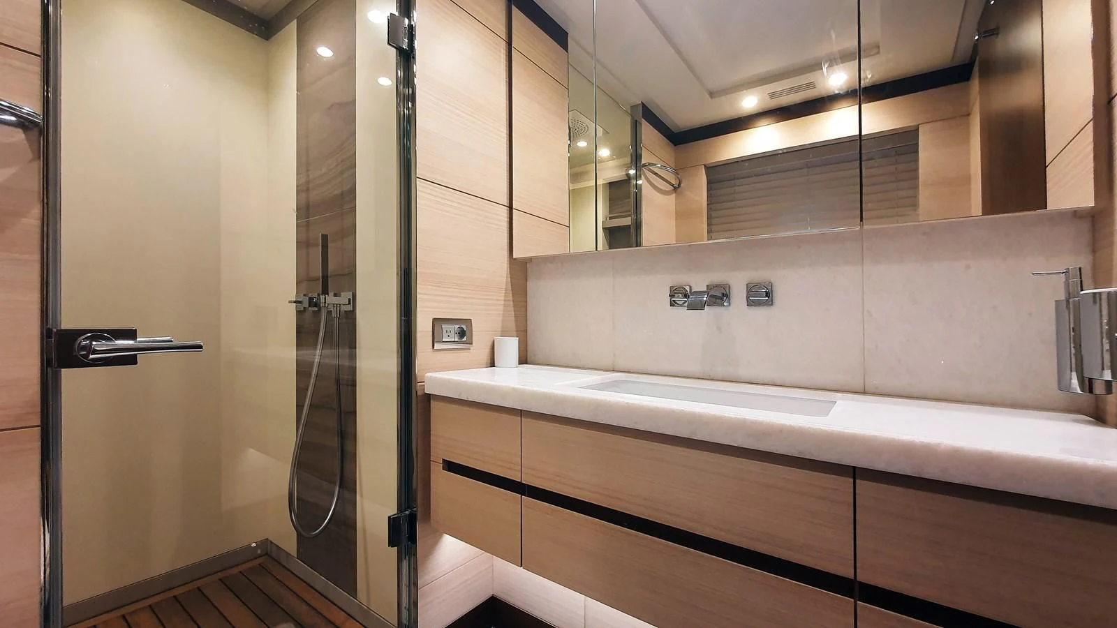 a bathroom with a large mirror aboard CALYPSO Yacht for Charter