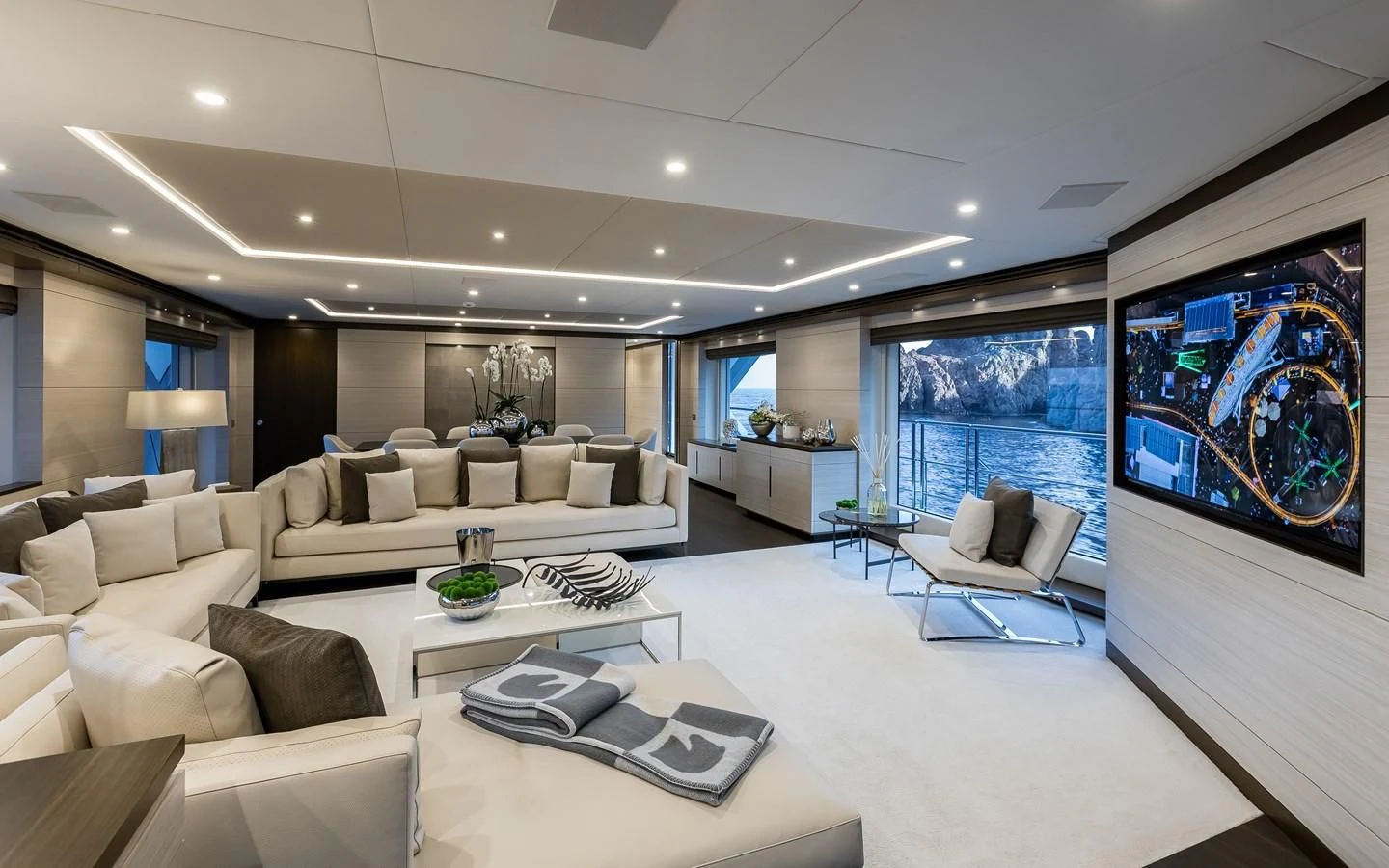 a living room with a large screen aboard CALYPSO Yacht for Charter