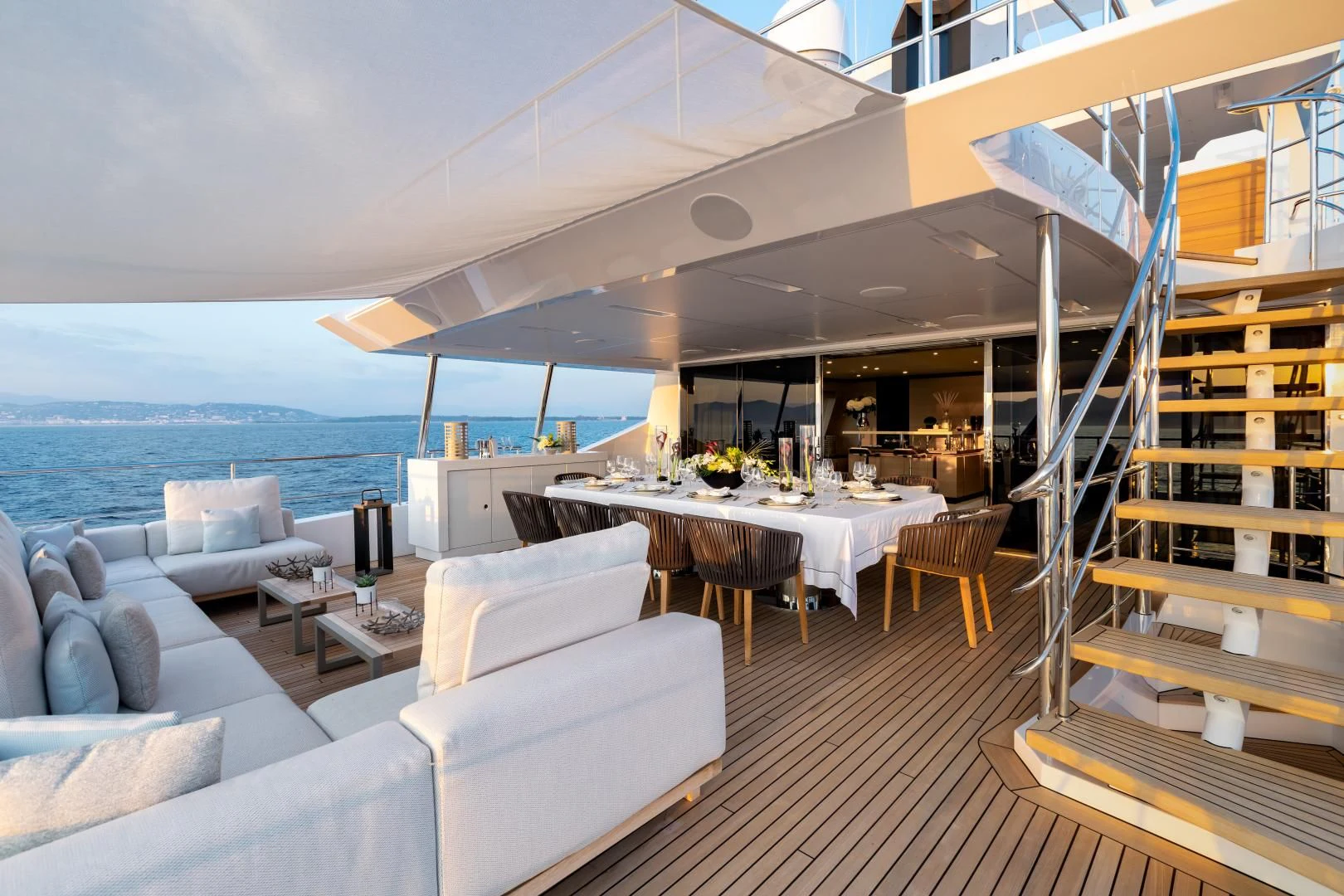 a room with a table and couches aboard CALYPSO Yacht for Charter