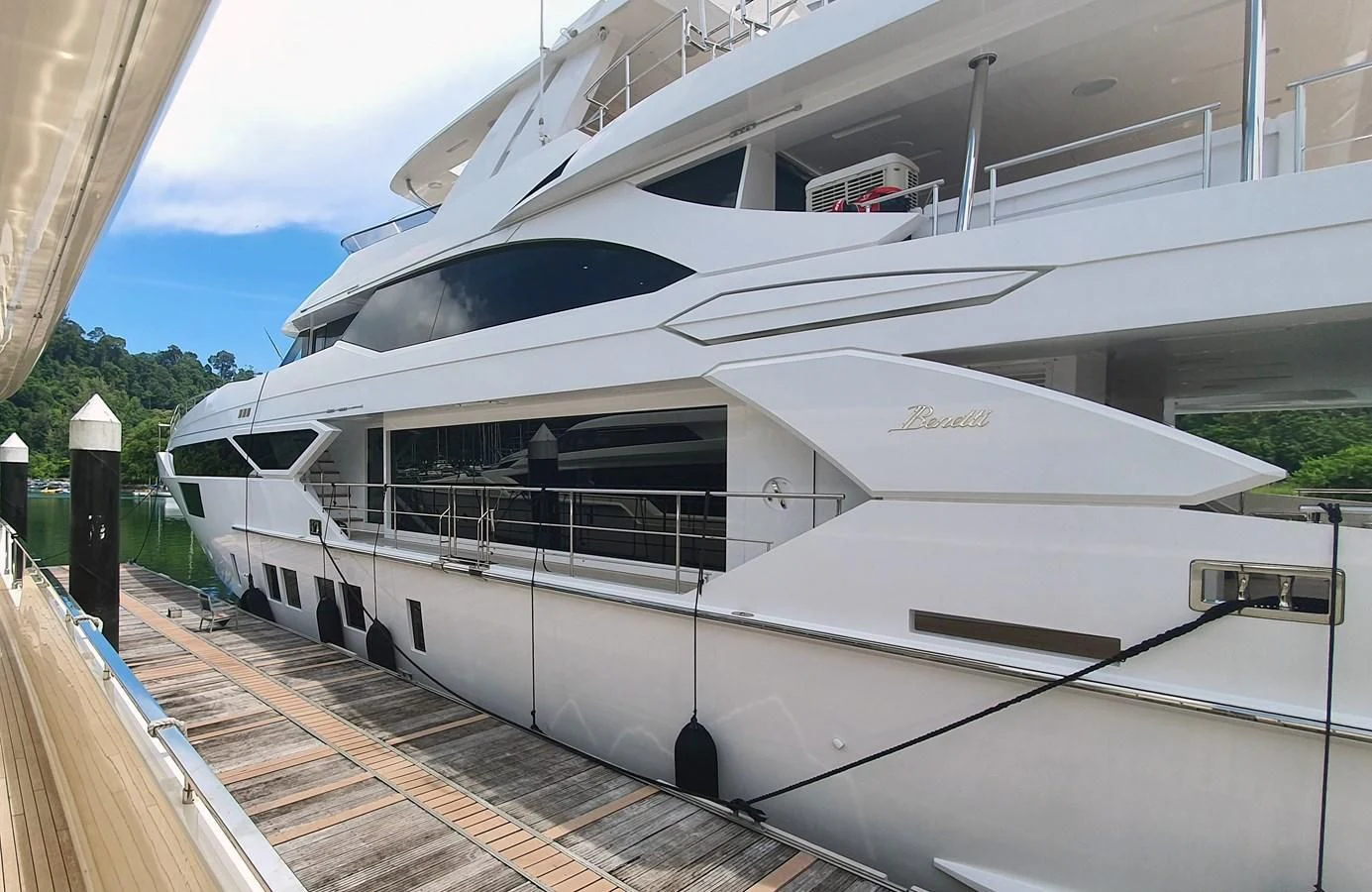 a white yacht on a dock aboard CALYPSO Yacht for Charter