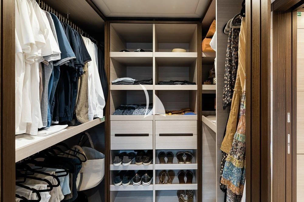 a closet full of clothes aboard CALYPSO Yacht for Charter
