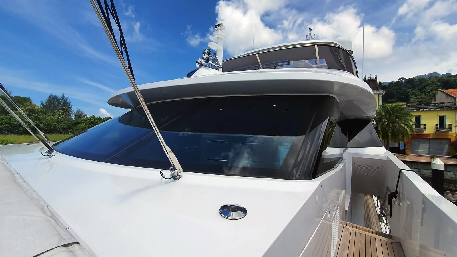a white yacht on a dock aboard CALYPSO Yacht for Charter