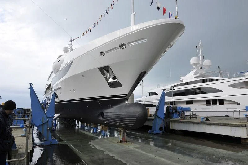 a boat docked at a pier aboard SURPINA Yacht for Sale
