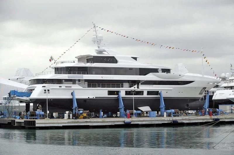 a large cruise ship docked aboard SURPINA Yacht for Sale