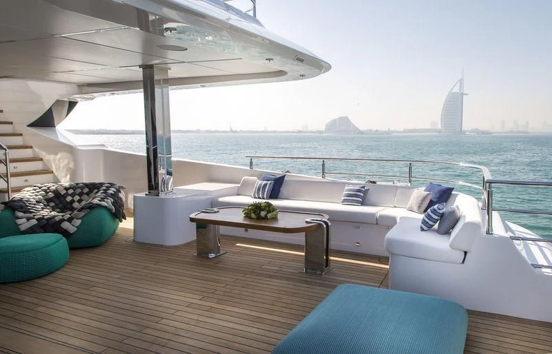 a room with a couch and a table on it aboard C'EST LA VIE Yacht for Sale