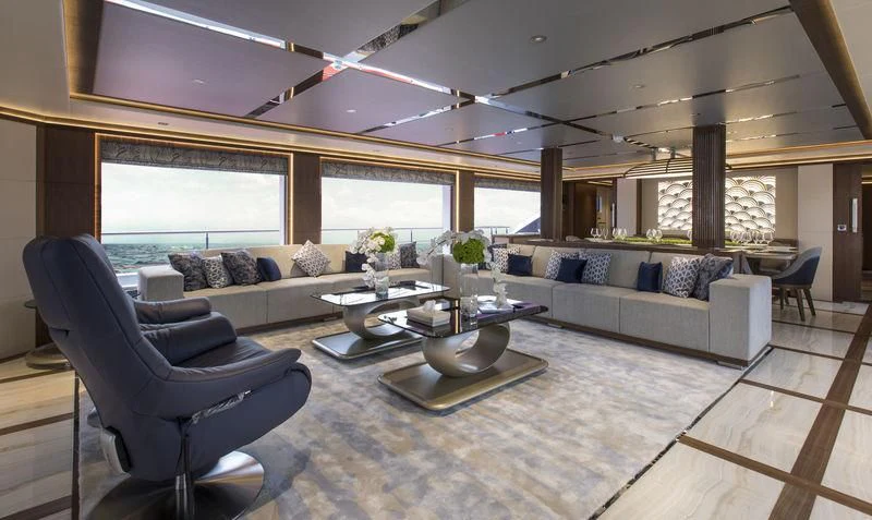 a living room with a couch and a table aboard C'EST LA VIE Yacht for Sale