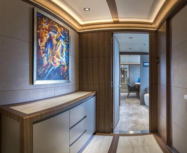 a room with a painting on the wall aboard C'EST LA VIE Yacht for Sale