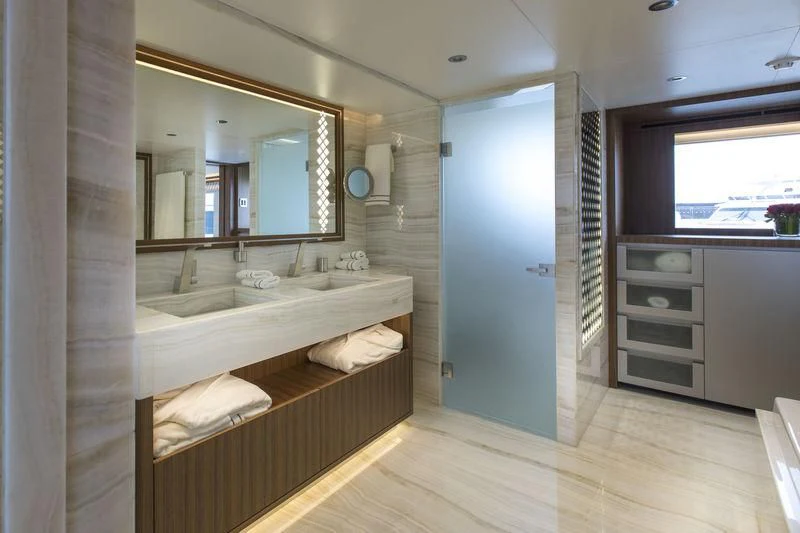 a bathroom with a large mirror aboard C'EST LA VIE Yacht for Sale