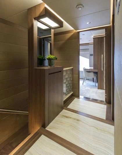 a wood cabinet in a room aboard C'EST LA VIE Yacht for Sale