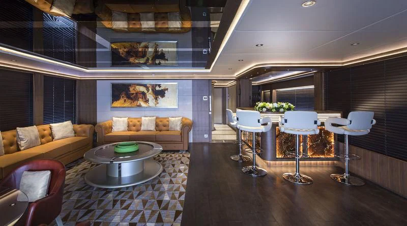 a living room with a table and chairs aboard C'EST LA VIE Yacht for Sale
