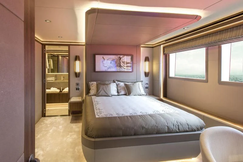 a bedroom with a bed aboard C'EST LA VIE Yacht for Sale