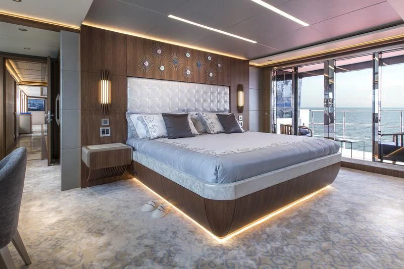 a large bed in a room aboard C'EST LA VIE Yacht for Sale