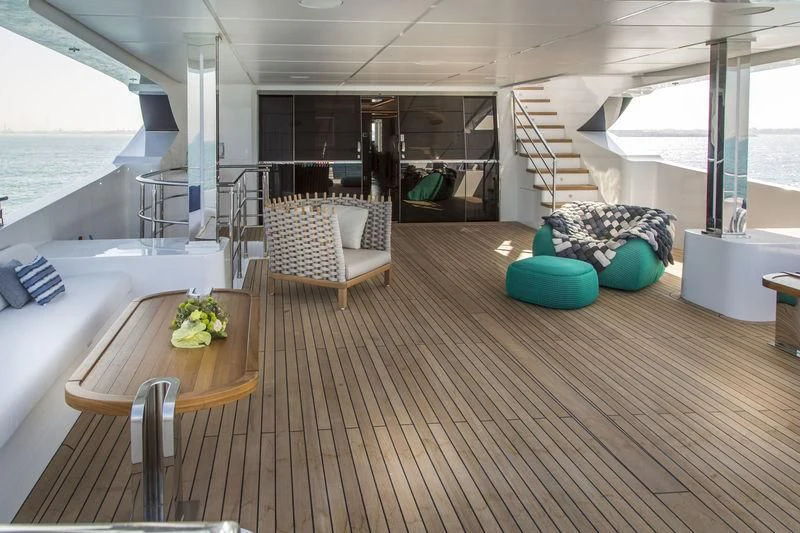 a room with a table and chairs aboard C'EST LA VIE Yacht for Sale