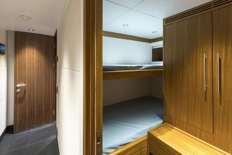 a room with a wood door and a wood cabinet aboard C'EST LA VIE Yacht for Sale