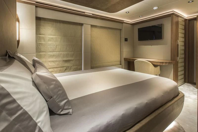 a bed in a room aboard C'EST LA VIE Yacht for Sale