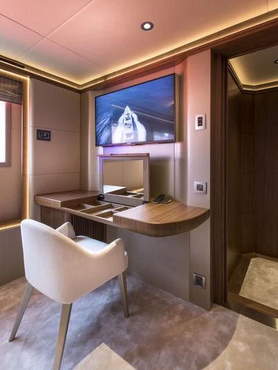 a room with a table and chairs aboard C'EST LA VIE Yacht for Sale
