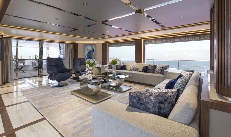 a living room with a large window aboard C'EST LA VIE Yacht for Sale
