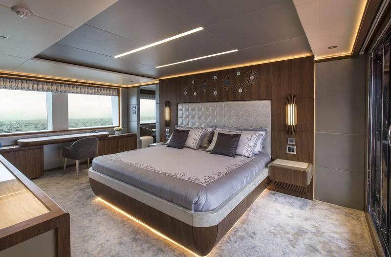 a large bed in a room aboard C'EST LA VIE Yacht for Sale