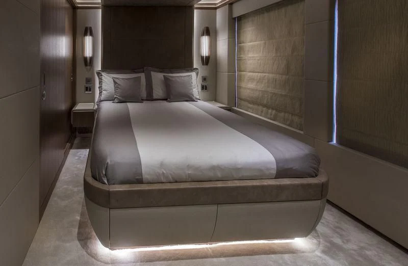 a bed with a white sheet aboard C'EST LA VIE Yacht for Sale
