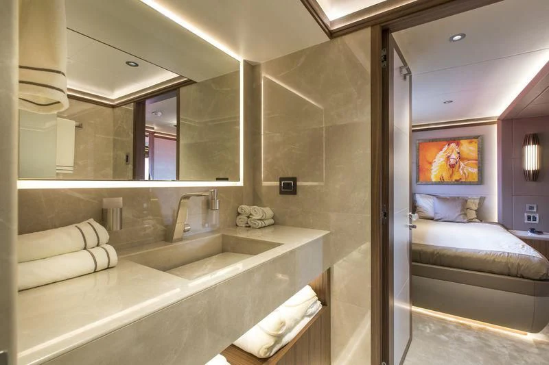 a bathroom with a large bathtub aboard C'EST LA VIE Yacht for Sale