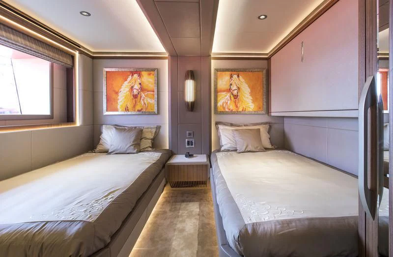 a room with two beds aboard C'EST LA VIE Yacht for Sale