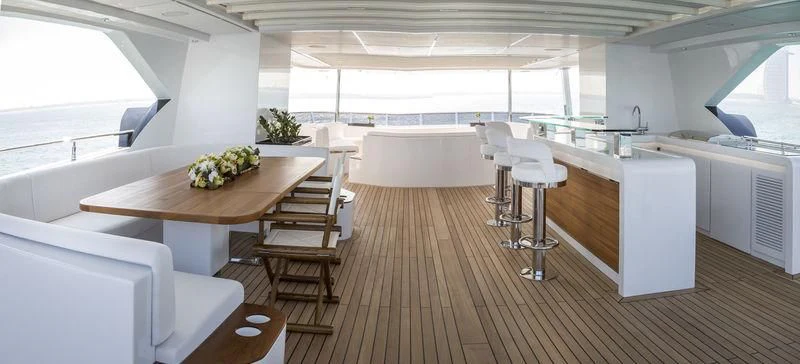 a large kitchen with a table and chairs aboard C'EST LA VIE Yacht for Sale