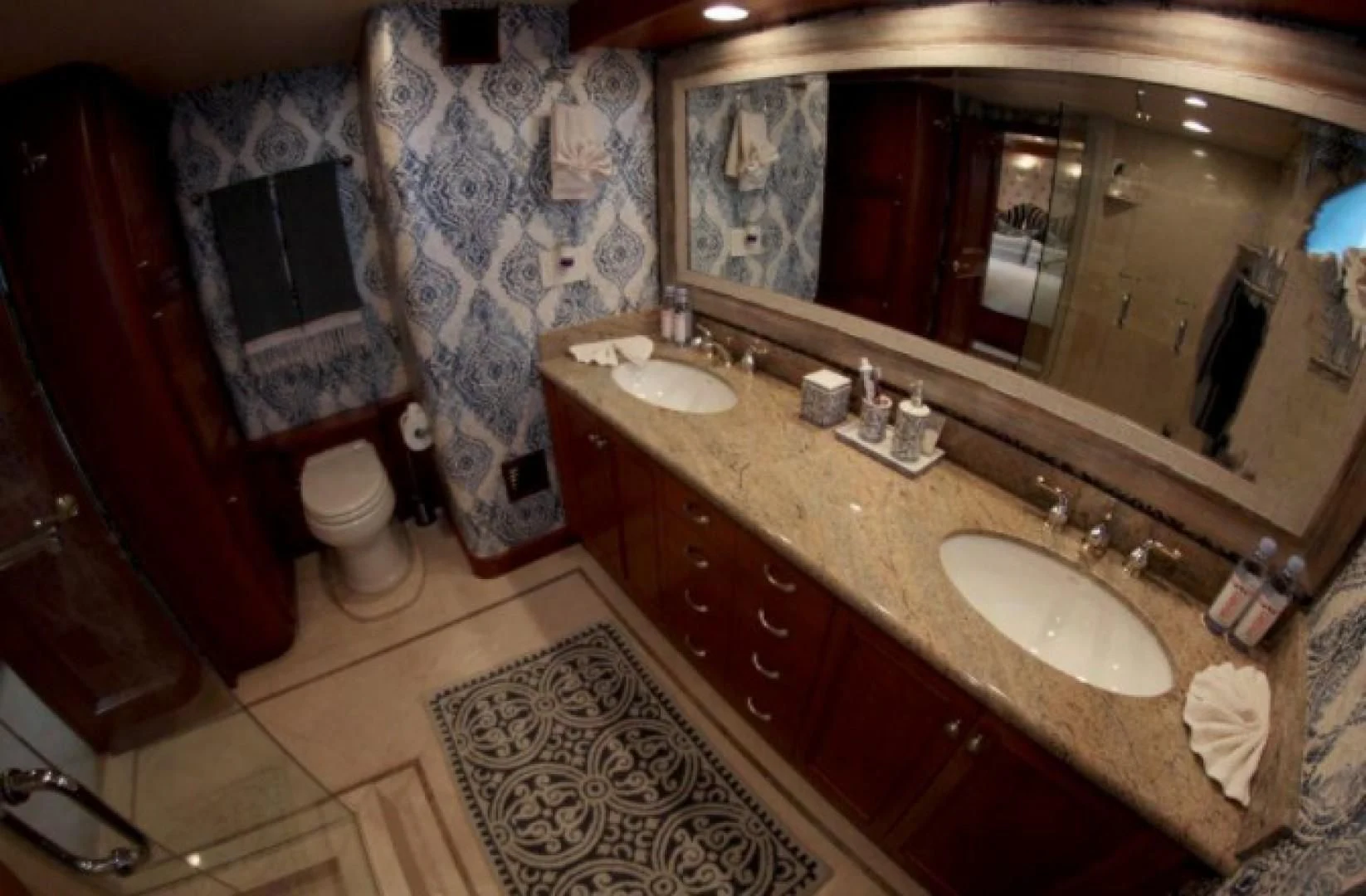 a bathroom with a countertop sink and a mirror aboard HURACAN Yacht for Sale