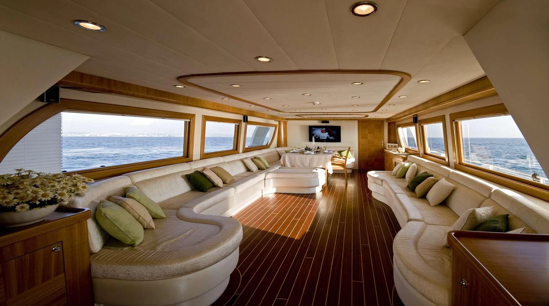 a large room with a bed and a tv aboard AZMIM Yacht for Sale