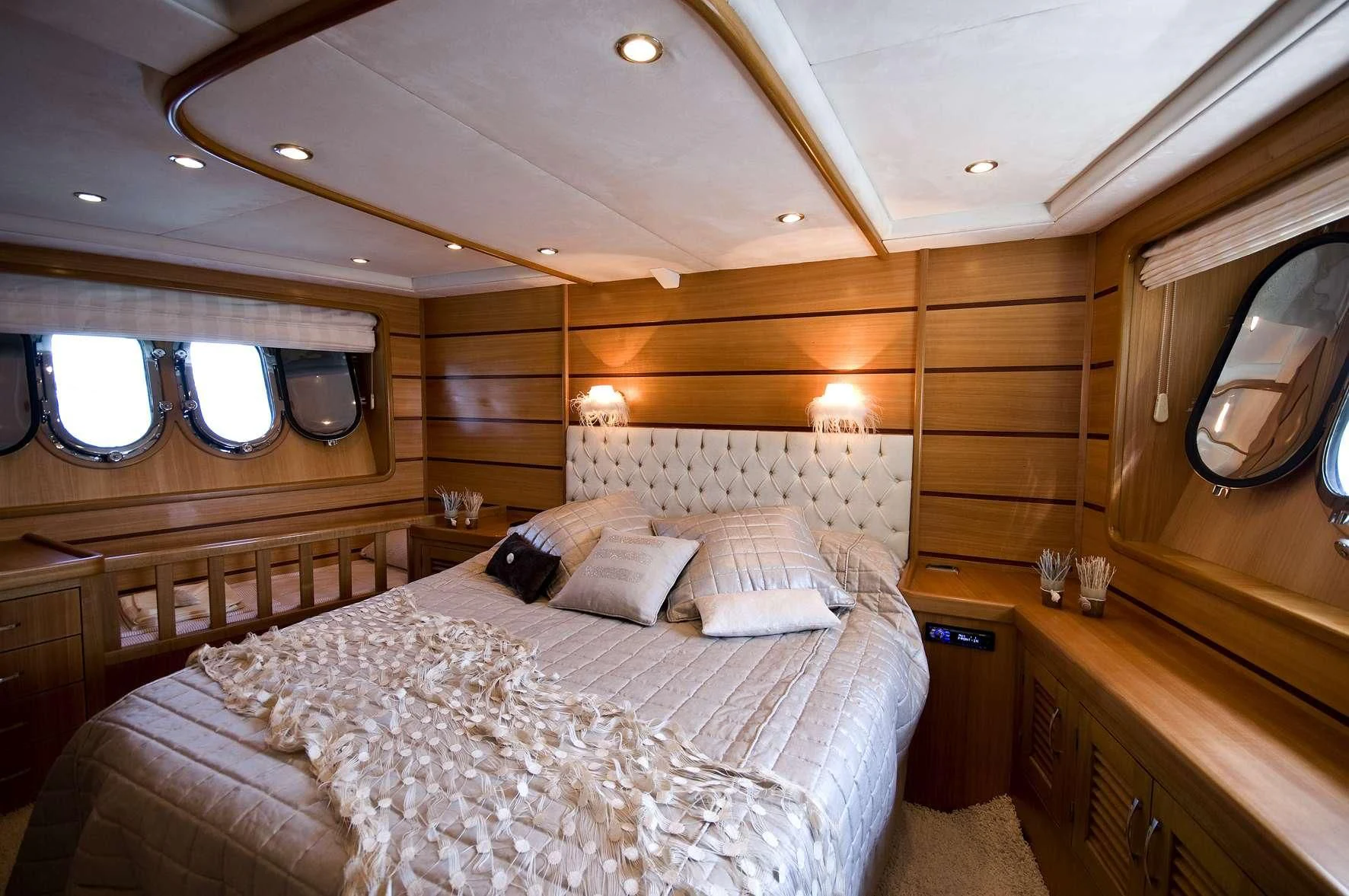 a room with a bed and a mirror aboard AZMIM Yacht for Sale