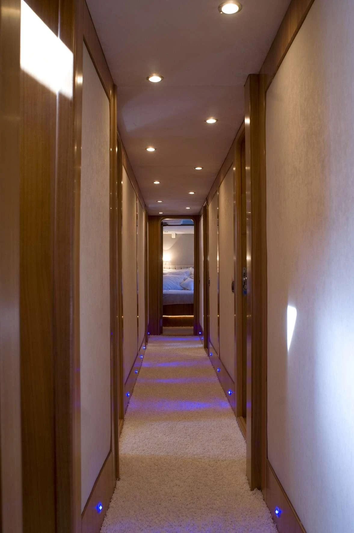 a hallway with a door and a window aboard AZMIM Yacht for Sale