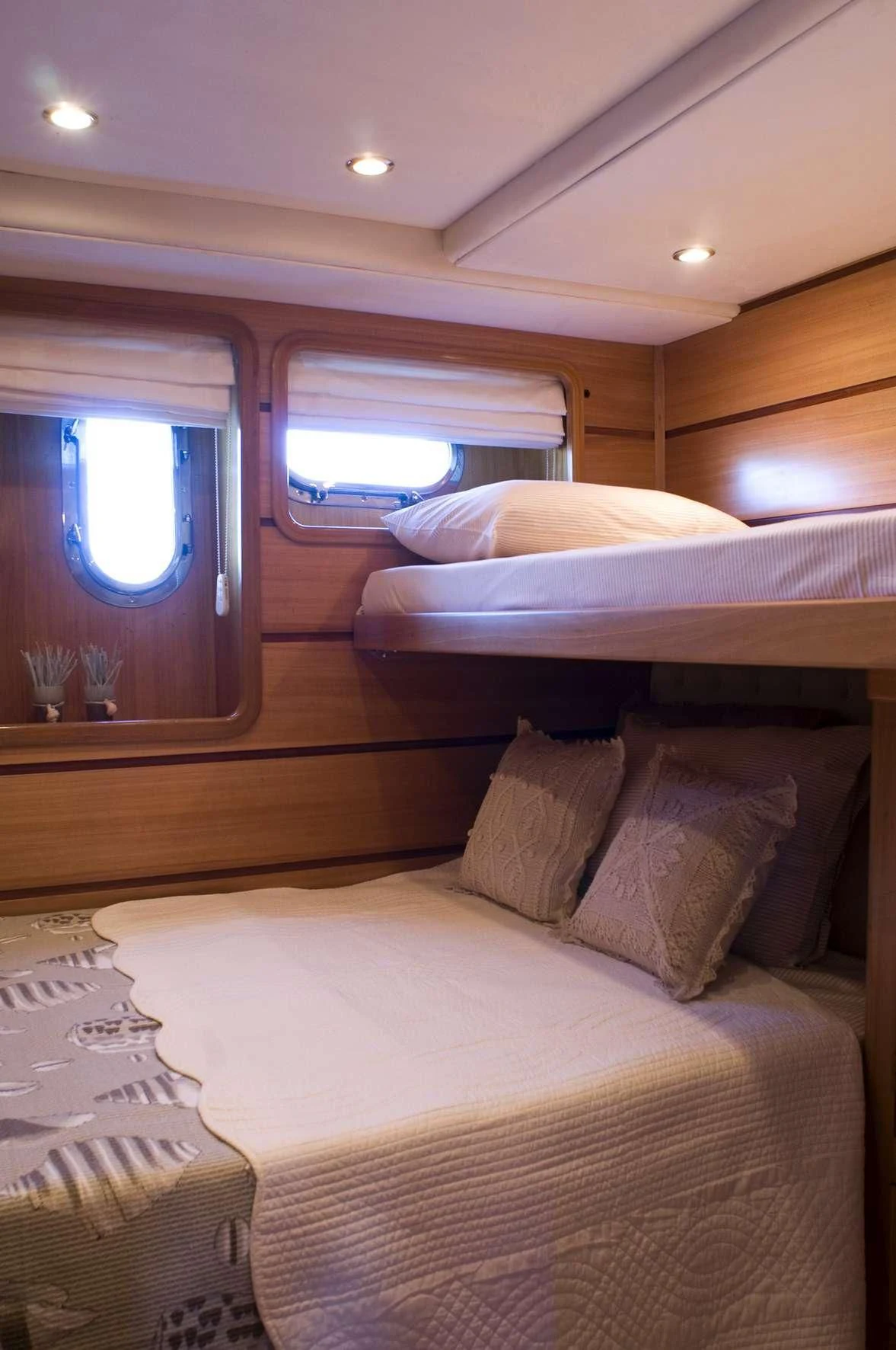 a bed with pillows aboard AZMIM Yacht for Sale