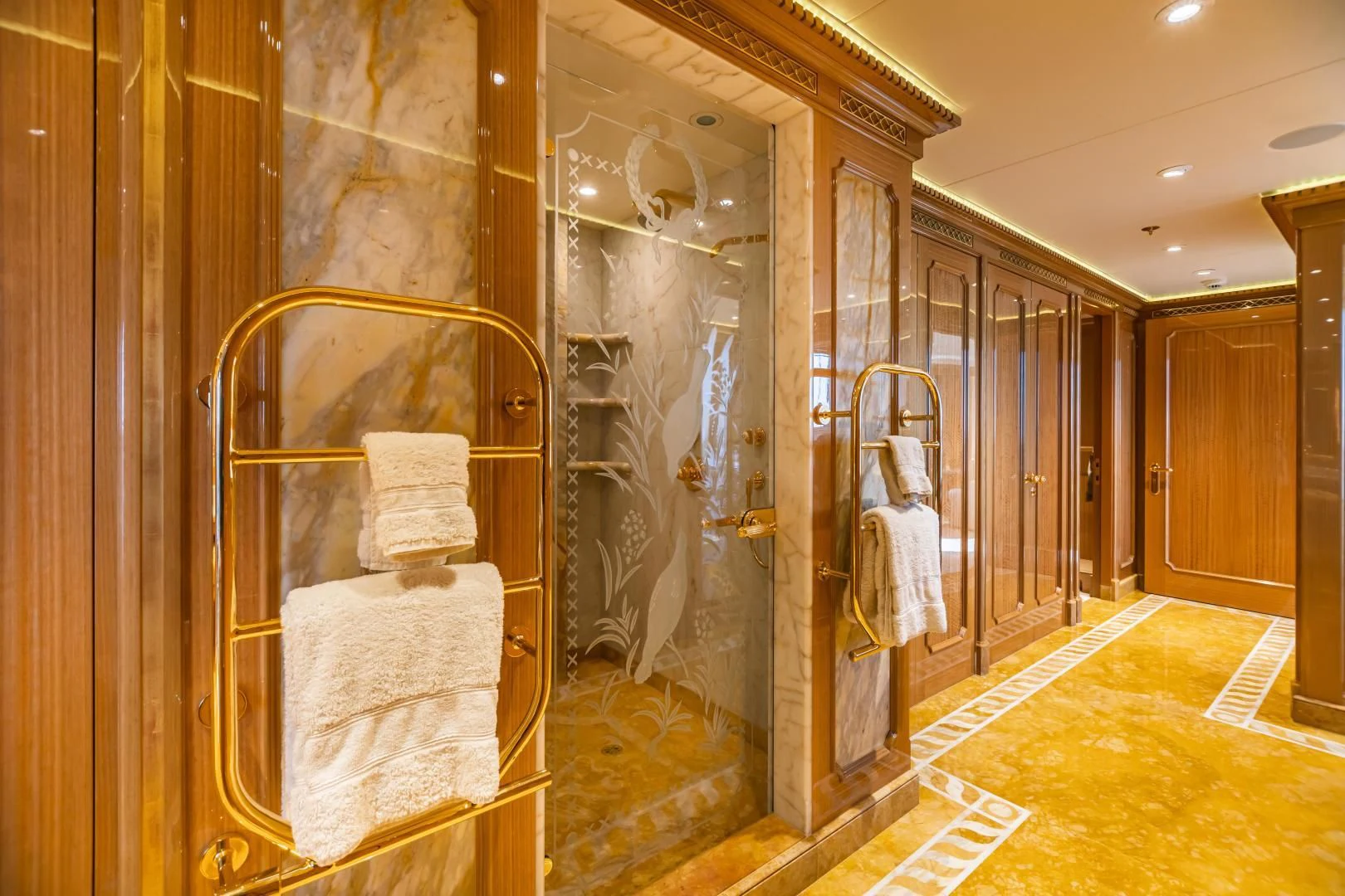 a fancy bathroom with a large mirror aboard ACTA Yacht for Charter