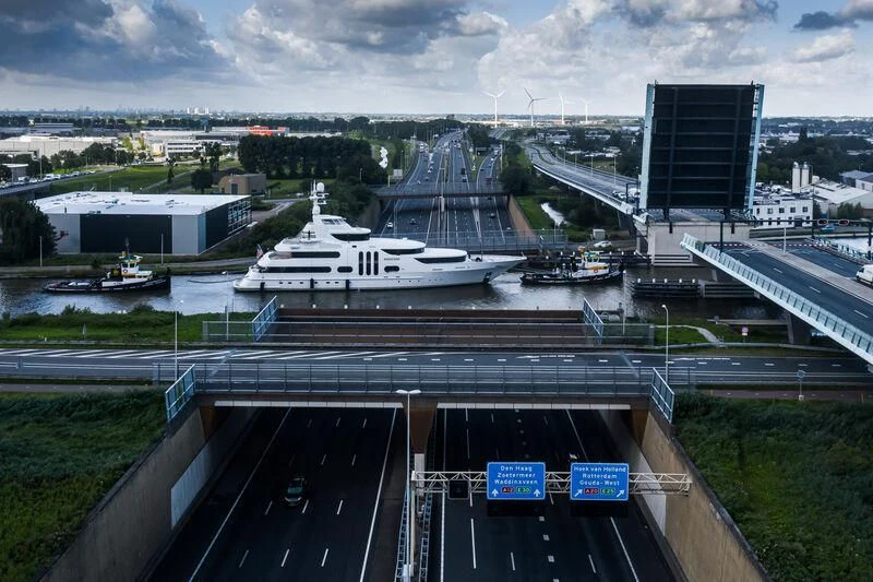 a bridge over water with boats aboard ACTA Yacht for Charter