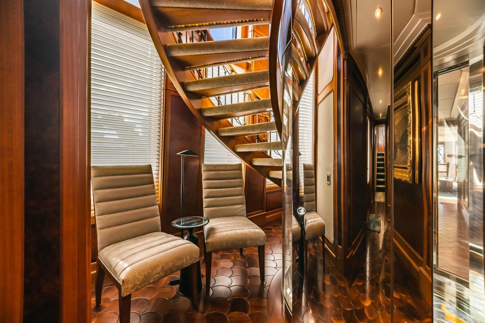 a room with a chair and a table and chairs aboard ACTA Yacht for Charter