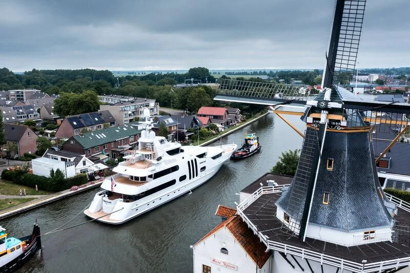 a large boat docked at a harbor aboard ACTA Yacht for Charter
