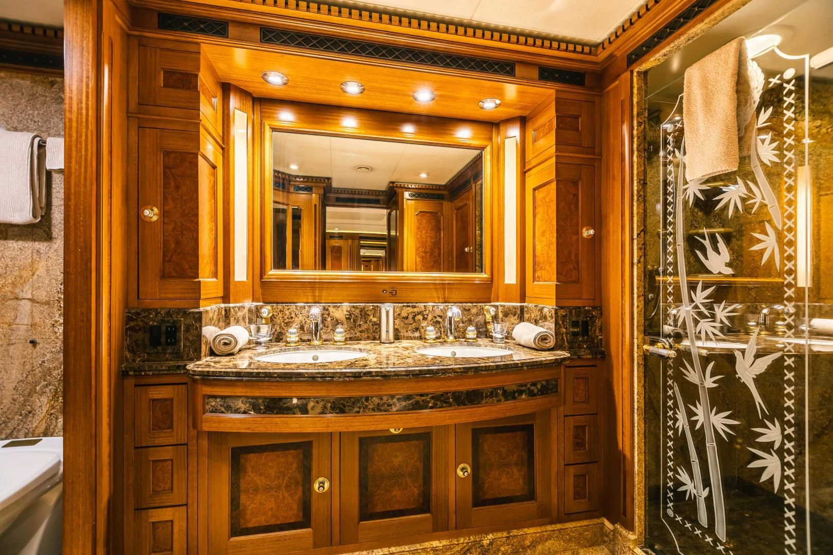 a bathroom with a large mirror aboard ACTA Yacht for Charter