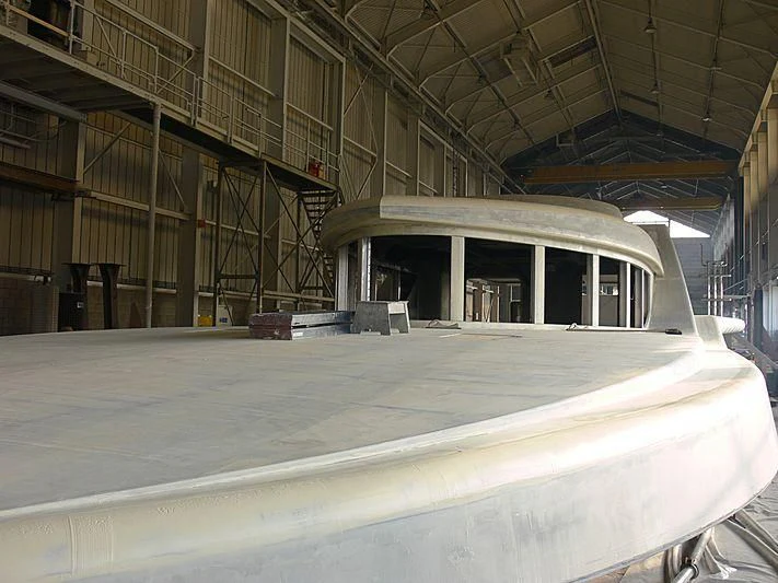 a large factory with a large white pipe in the middle aboard ACTA Yacht for Charter