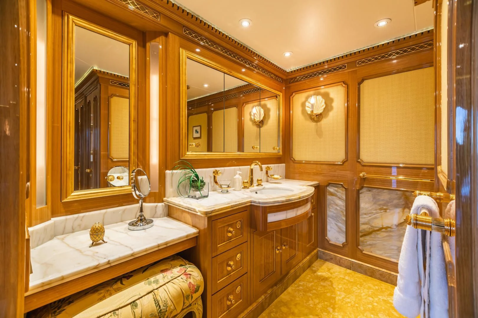 a bathroom with a large mirror aboard ACTA Yacht for Charter