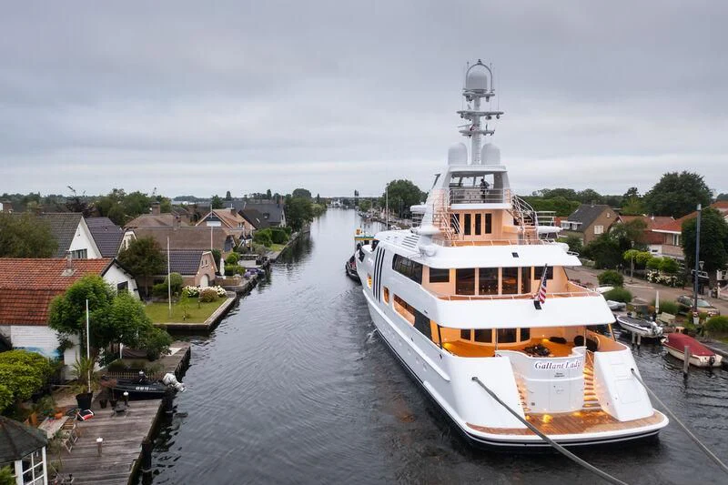 a large boat docked at a pier aboard ACTA Yacht for Charter