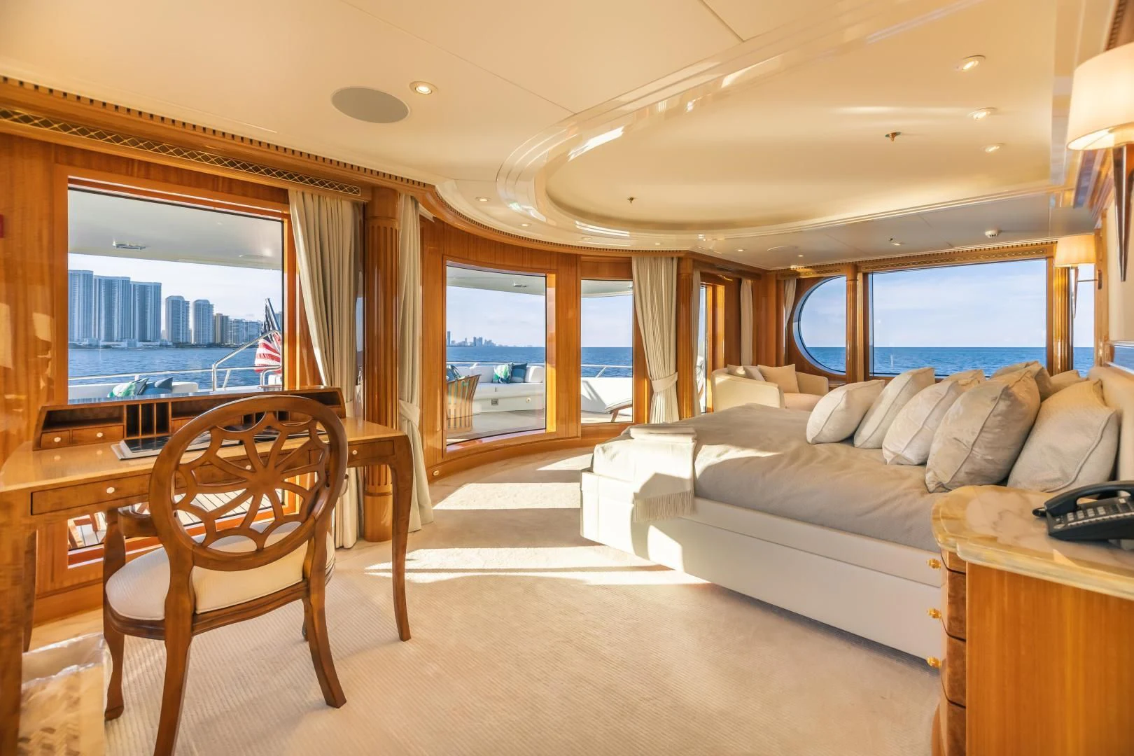 a bedroom with a bed and a couch aboard ACTA Yacht for Charter