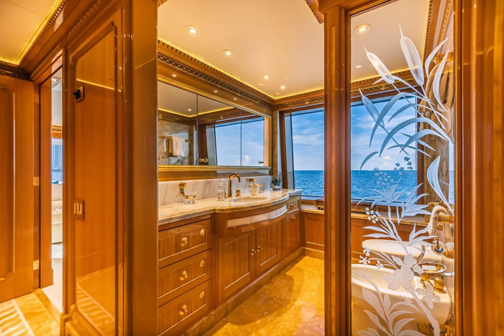 a bathroom with a large window aboard ACTA Yacht for Charter