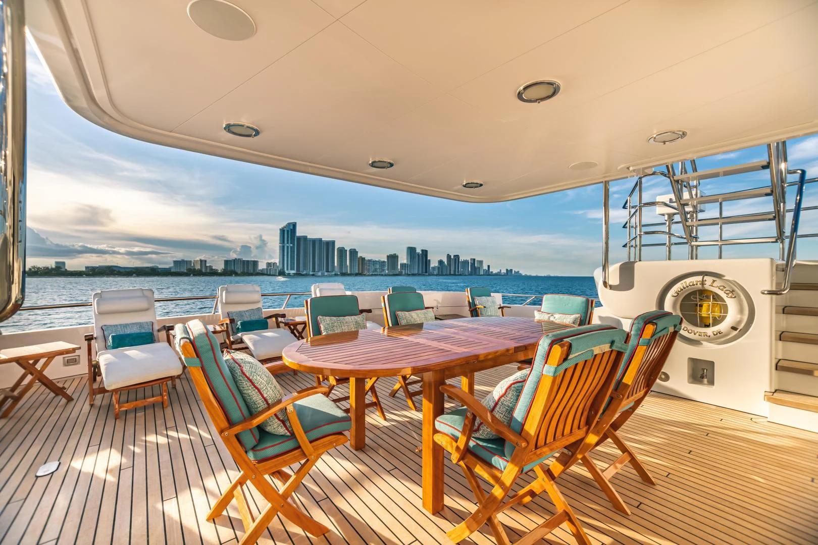 a deck with a view of the city and water aboard ACTA Yacht for Charter