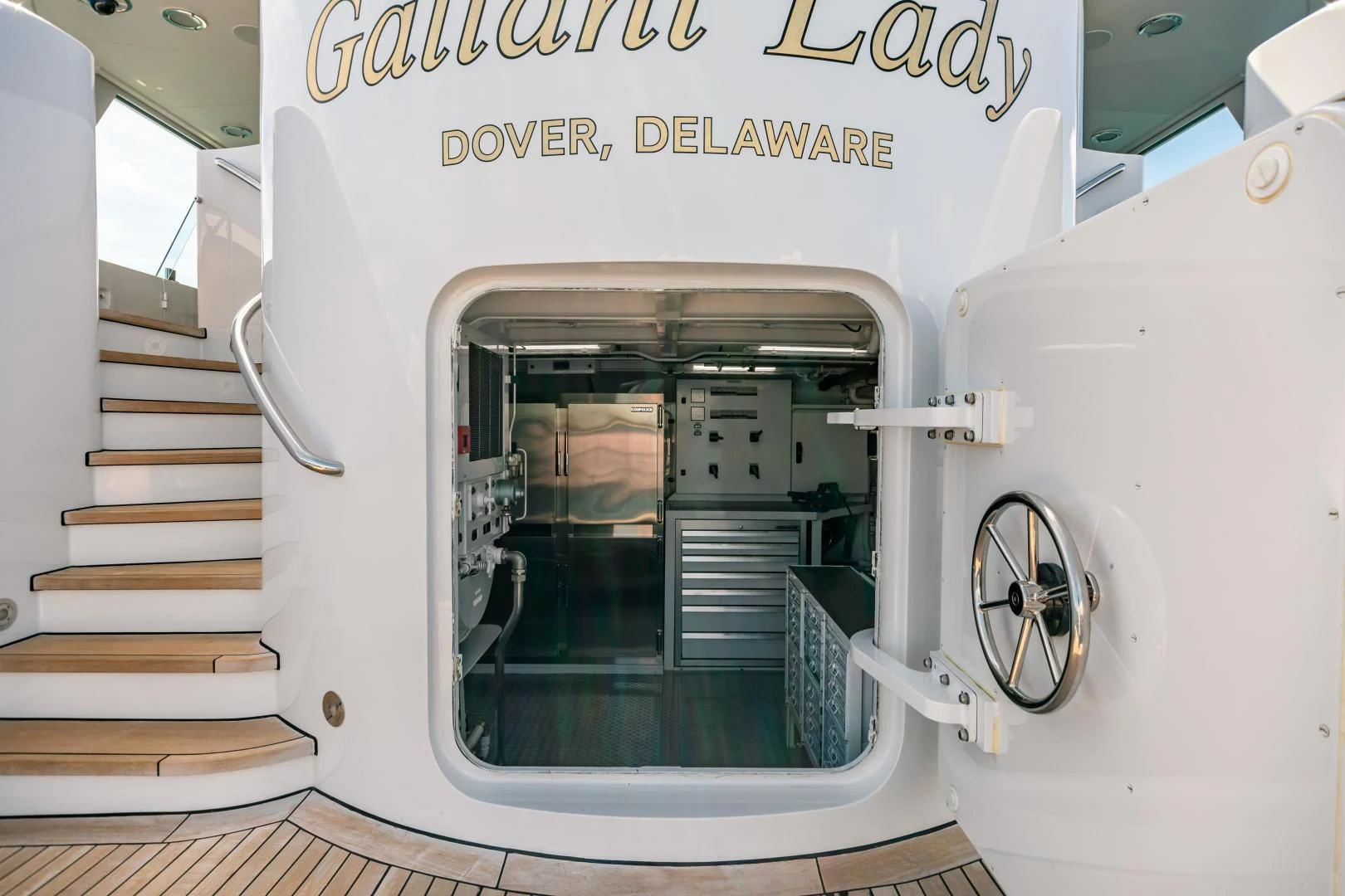 a white machine with a door open aboard ACTA Yacht for Charter