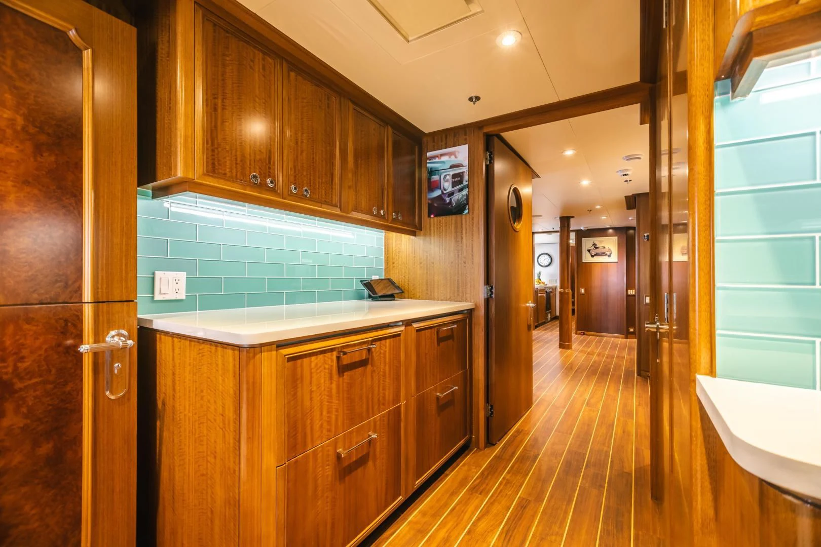 a kitchen with wooden cabinets aboard ACTA Yacht for Charter