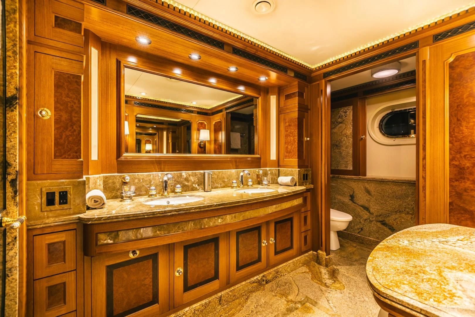 a bathroom with a large mirror aboard ACTA Yacht for Charter
