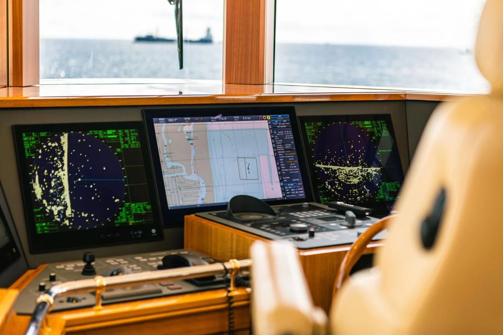 a desk with multiple monitors aboard ACTA Yacht for Charter