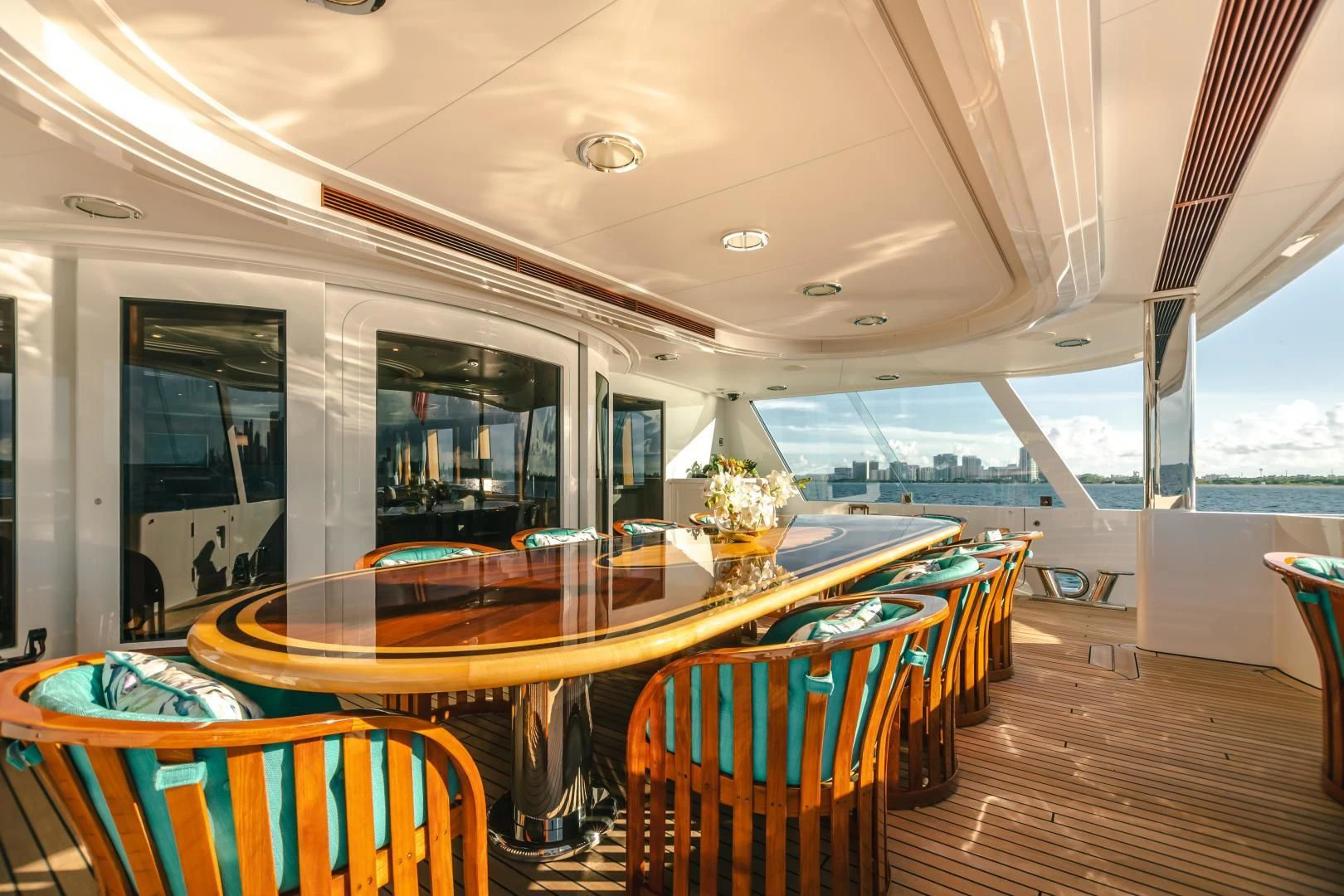 a room with a table and chairs aboard ACTA Yacht for Charter
