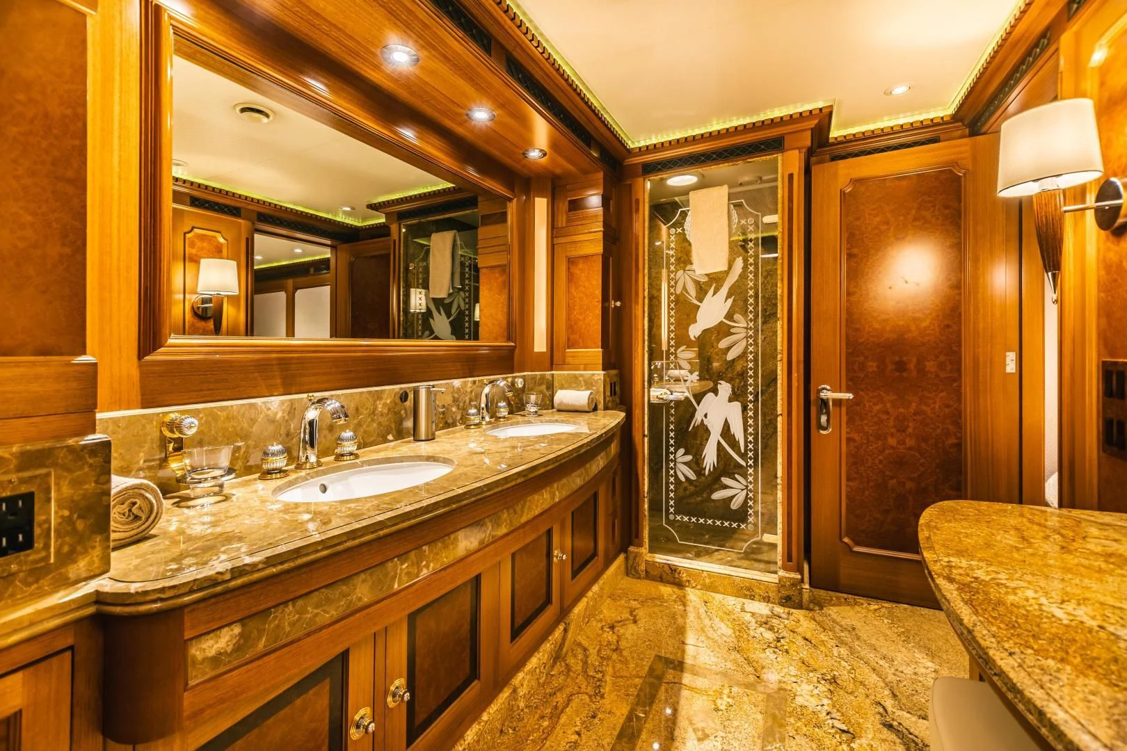 a bathroom with marble counters aboard ACTA Yacht for Charter