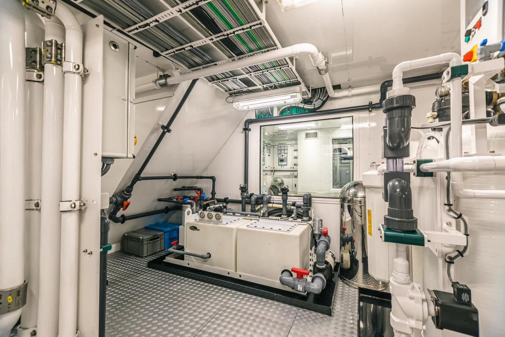 a room with machinery aboard ACTA Yacht for Charter