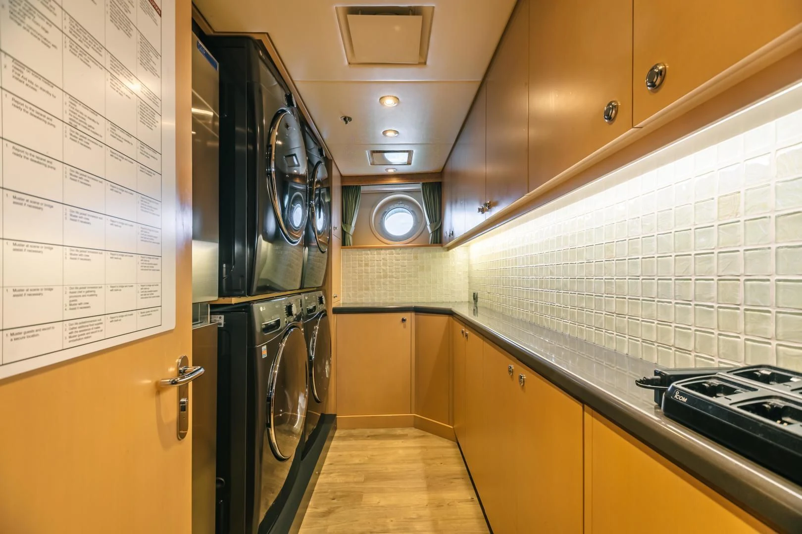 a kitchen with a large stainless steel oven and cabinets aboard ACTA Yacht for Charter